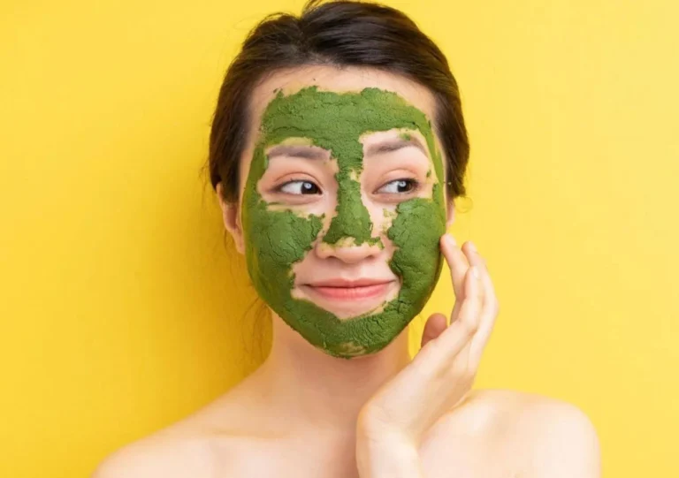 A Woman Wearing Green Herbal Mask on Her Face