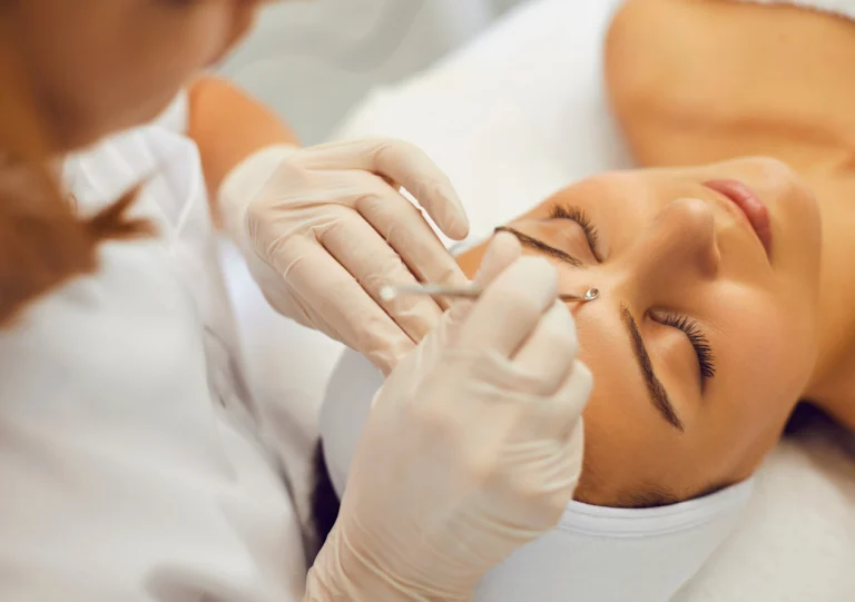 A Woman is being Treated by a Dermatologist