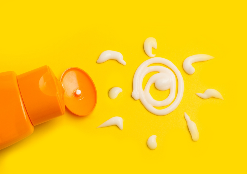 Sunscreen on yellow background